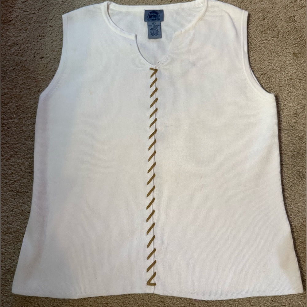 Cambridge Dry Goods white sweater knit top with suede stitching.